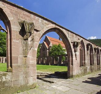 Cloister ruins with a view toward the Chapel of St. Mary at Hirsau Monastery